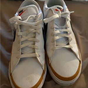 Nike Women’s White and Gold Sneakers